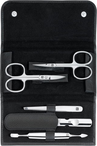 Geöffnetes ZWILLING Classic Set 5tlg. in schwarz mit den meistgenutzten Pflegeinstrumenten aus rostfreiem Edelstahl.