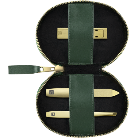 Geöffnetes ZWILLING Premium Apfelleder Set 3tlg. in Grün mit Reißverschluss und essentiellen Pflegeinstrumenten (Kompakt-Nagelknipser, Saphir-Nagelfeile und schräge Pinzette) in matt-gold.