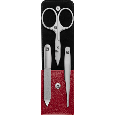 Geöffnetes ZWILLING Premium Maniküre Set 3tlg. in rot mit Druckknopfverschluss und essentiellen Pflegeinstrumenten aus rostfreiem Edelstahl.