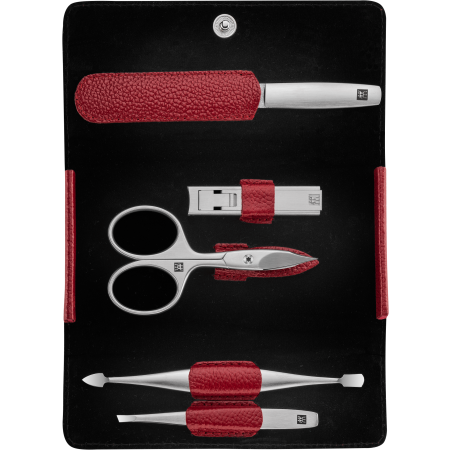 Geöffnetes ZWILLING Premium Maniküre Set 5tlg. in Rot mit Druckknopfverschluss und den meistgenutzten Pflegeinstrumenten aus rostfreiem Edelstahl.