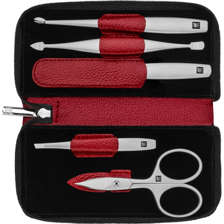 Geöffnetes ZWILLING Premium Maniküre Set 5tlg. in rot mit Reißverschluss und den meistgenutzten Pflegeinstrumenten aus rostfreiem Edelstahl.