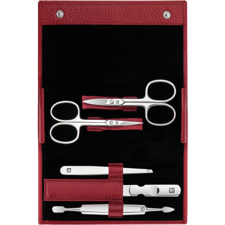 Geöffnetes ZWILLING Classic Set 5tlg. in rot mit Druckknopfverschluss und den meistgenutzten Pflegeinstrumenten aus rostfreiem Edelstahl.
