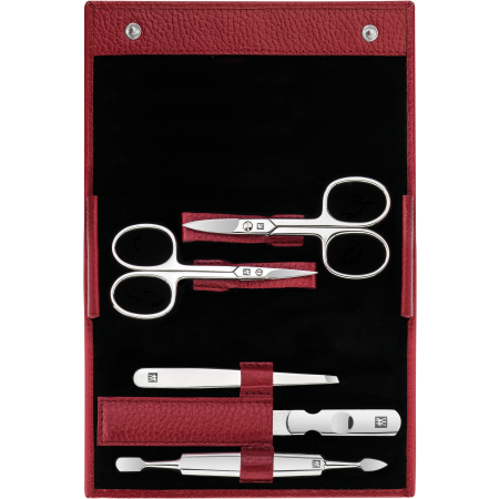 Geöffnetes ZWILLING Classic Set 5tlg. in rot mit Druckknopfverschluss und den meistgenutzten Pflegeinstrumenten aus rostfreiem Edelstahl.