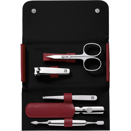 Geöffnetes ZWILLING Classic Set 5tlg. in rot mit Druckknopfverschluss und den meistgenutzten Pflegeinstrumenten aus rostfreiem Edelstahl.