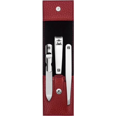 Geöffnetes ZWILLING Classic Set 3tlg. in rot mit Druckknopfverschluss und essentiellen Pflegeinstrumenten aus rostfreiem Edelstahl.