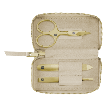 Geöffnetes ZWILLING Premium Set 3tlg. in Beige mit Reißverschluss und essentiellen Pflegeinstrumenten in gold.