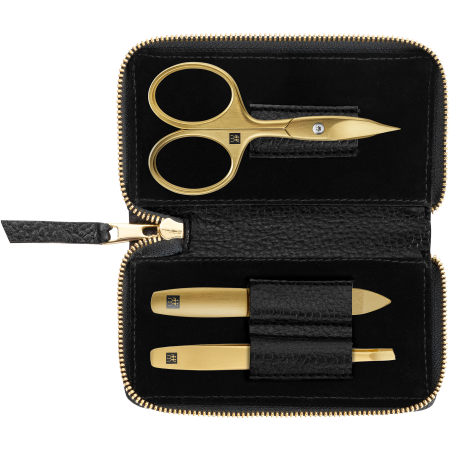 Geöffnetes ZWILLING Premium Set 3tlg. in Schwarz mit Reißverschluss und essentiellen Pflegeinstrumenten in gold.