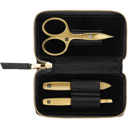 Geöffnetes ZWILLING Premium Set 3tlg. in Schwarz mit Reißverschluss und essentiellen Pflegeinstrumenten in gold.