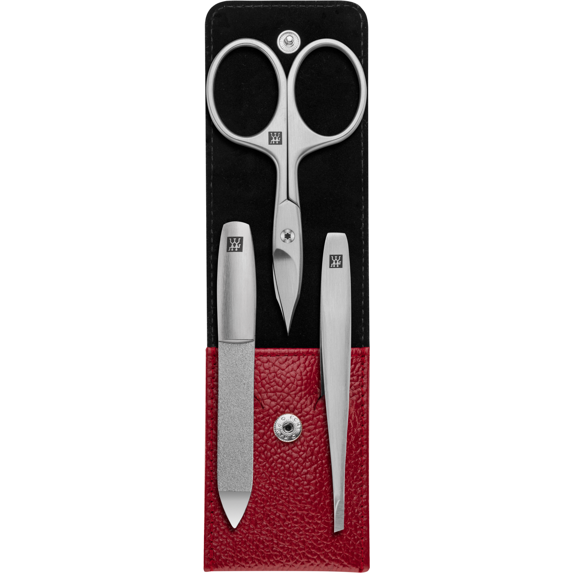 Geöffnetes ZWILLING Premium Maniküre Set 3tlg. in rot mit Druckknopfverschluss und essentiellen Pflegeinstrumenten aus rostfreiem Edelstahl.