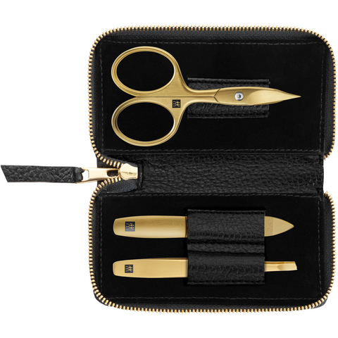 Geöffnetes ZWILLING Premium Set 3tlg. in Schwarz mit Reißverschluss und essentiellen Pflegeinstrumenten in gold.