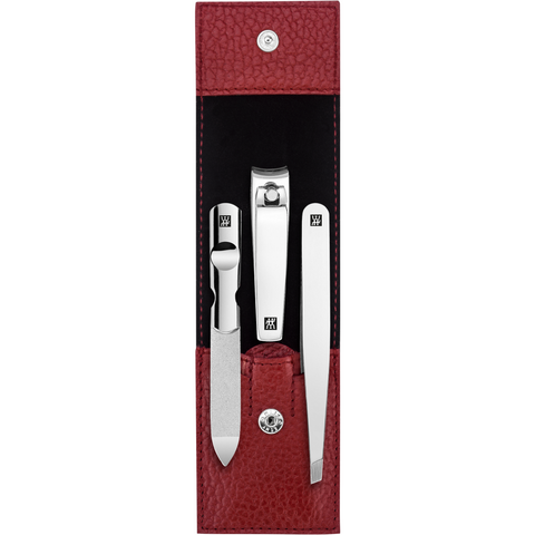 Geöffnetes ZWILLING Classic Set 3tlg. in rot mit Druckknopfverschluss und essentiellen Pflegeinstrumenten aus rostfreiem Edelstahl.