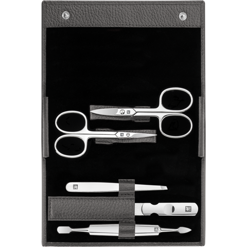 Geöffnetes ZWILLING Classic Set 5tlg. in anthrazit mit Druckknopfverschluss und den meistgenutzten Pflegeinstrumenten aus rostfreiem Edelstahl.