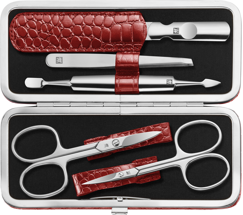 Geöffnetes ZWILLING Classic Set 5tlg. in rot mit Metallrahmen, mit den meistgenutzten Pflegeinstrumenten aus rostfreiem Edelstahl.