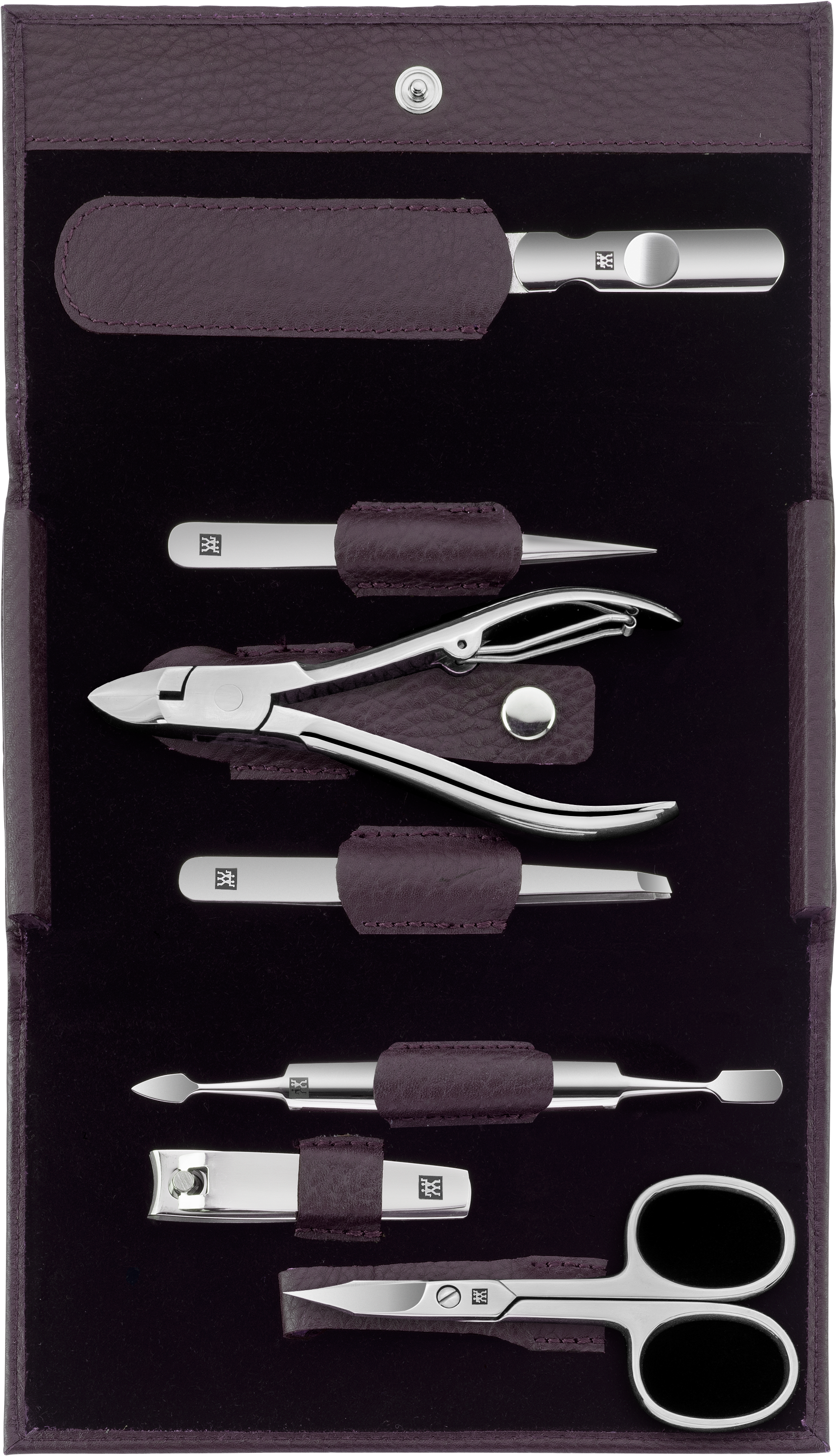 Geöffnetes ZWILLING Classic Set 7tlg. in lila mit den meistgenutzten Pflegeinstrumenten aus rostfreiem Edelstahl.