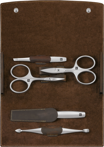 Geöffnetes ZWILLING Premium Set 5tlg. in braun mit den meistgenutzten Pflegeinstrumenten aus rostfreiem Edelstahl.