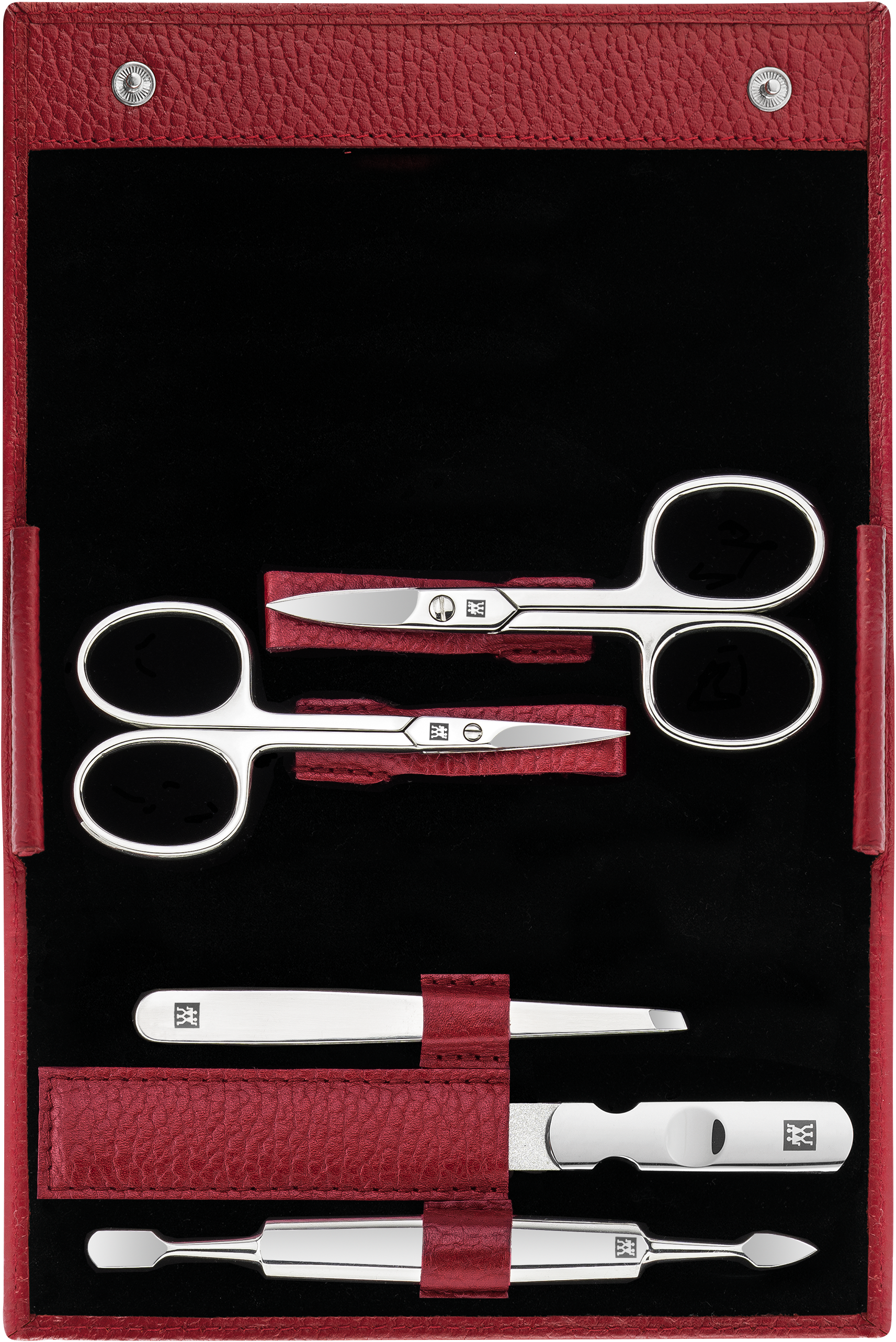Geöffnetes ZWILLING Classic Set 5tlg. in rot mit den meistgenutzten Pflegeinstrumenten aus rostfreiem Edelstahl.