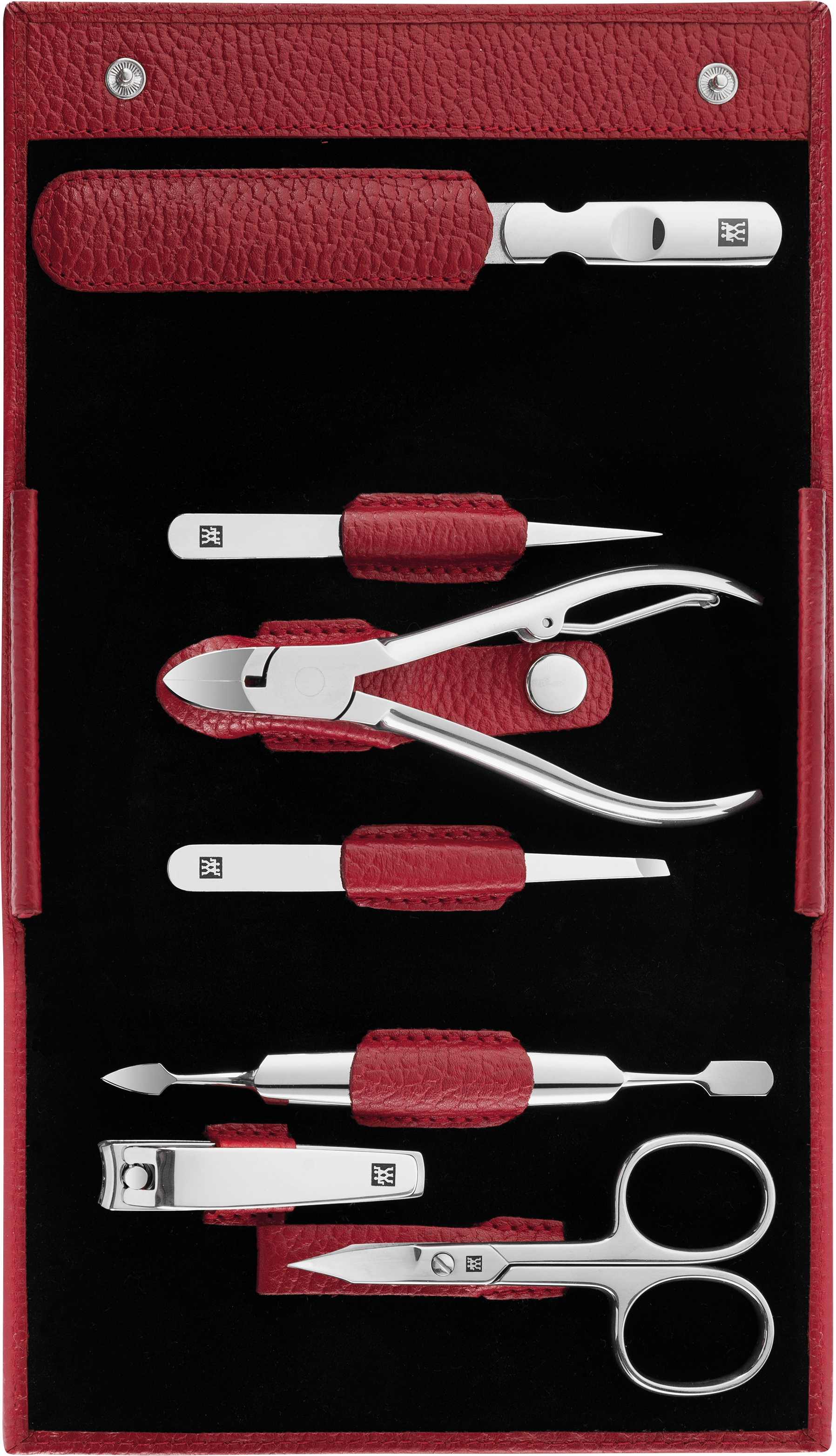 Geöffnetes ZWILLING Classic Set 7tlg. in rot, mit den meistgenutzten Pflegeinstrumenten aus rostfreiem Edelstahl.