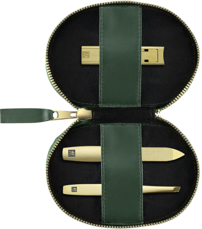 Geöffnetes ZWILLING Premium Apfelleder Set 3tlg. in grün mit essentiellen Pflegeinstrumenten (Kompakt-Nagelknipser, Saphir-Nagelfeile und schräge Pinzette) in matt-gold.