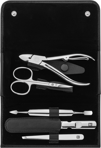 Geöffnetes ZWILLING Classic Set 5tlg. in schwarz mit den meistgenutzten Pflegeinstrumenten aus rostfreiem Edelstahl.