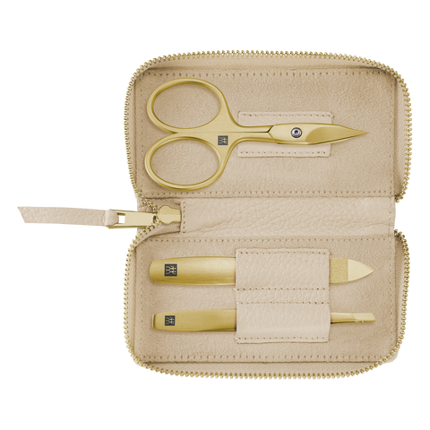 Geöffnetes ZWILLING Premium Set 3tlg. in beige mit essentiellen Pflegeinstrumenten in gold.