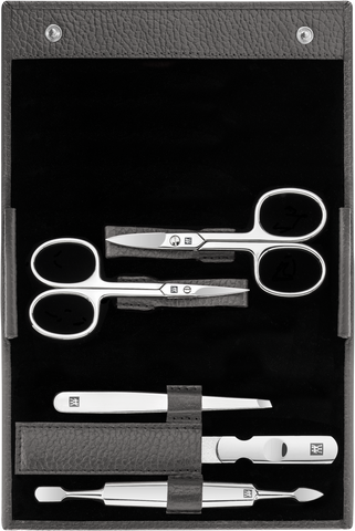 Geöffnetes ZWILLING Classic Set 5tlg. in anthrazit mit den meistgenutzten Pflegeinstrumenten aus rostfreiem Edelstahl.