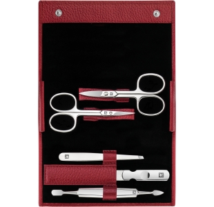 Geöffnetes ZWILLING Classic Set 5tlg. in rot mit den meistgenutzten Pflegeinstrumenten aus rostfreiem Edelstahl.