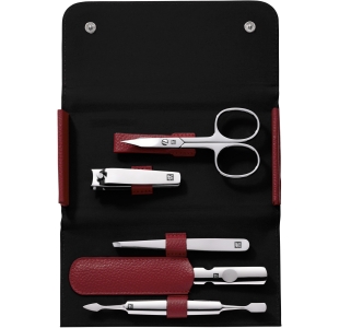 Geöffnetes ZWILLING Classic Set 5tlg. in rot mit den meistgenutzten Pflegeinstrumenten aus rostfreiem Edelstahl.