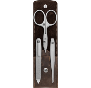 Geöffnetes ZWILLING Premium Set 3tlg. in braun mit essentiellen Pflegeinstrumenten aus rostfreiem Edelstahl.